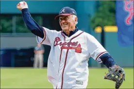  ?? CURTIS COMPTON / ATLANTA JOURNAL-CONSTITUTI­ON ?? Atlanta Braves former pitcher Phil Niekro throws out the ceremonial pitch before the Braves’ game against the St. Louis Cardinals during game 5 in theNLDS onOct. 9, 2019, in Atlanta.