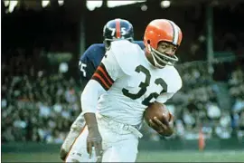  ?? AP FILE PHOTO ?? Jimmy Brown (32), running back for the Cleveland Browns, is shown in action against the New York Giants in Cleveland, Ohio, on Nov. 14, 1965.