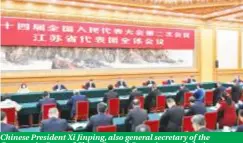  ?? ?? Chinese President Xi Jinping, also general secretary of the Communist Party of China Central Committee and chairman of the Central Military Commission, takes part in a deliberati­on with his fellow deputies from the delegation of Jiangsu Province at the second session of the 14th National People’s Congress (NPC) in Beijing, capital of China, March 5, 2024.