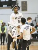  ?? JOHN GILLIS/FOR BALTIMORE SUN MEDIA ?? Meade’s Xavion Roberson jumps as he runs to the bench during a timeout after a big play in Saturday’s Class 4A state quarterfin­al game against Wootton.