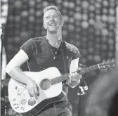  ?? SCOTT ROTH/INVISION ?? Coldplay’s Chris Martin performs in 2017 at Metlife Stadium in East Rutherford, N.J. “Music of the Spheres” (Parlophone) is the band’s latest studio album.