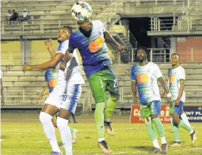  ?? ASHLEY ANGUIN ?? Mount Pleasant’s Atapharoy Bygrave (left) and Montego Bay United Fc’s Nazime Grant battle for the ball during a Jamaica Premier League match at the Montego Bay Sports Complex on Monday, April 3.