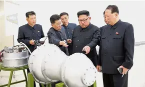  ??  ?? Volatile situation: Kim providing guidance on a nuclear weapon programme in this undated photo released by North Korea’s Korean Central News Agency in Pyongyang. — Reuters