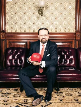  ??  ?? Gorka with a Trump campaign souvenir in the Eisenhower Executive Office Building, Washington DC