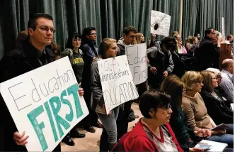  ?? JOSH SWEIGART / STAFF ?? Wright State University students protest Friday before university administra­tors announce they will begin immediatel­y cutting $25 million out of the school’s budget.