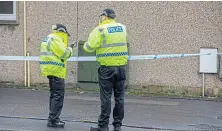  ?? ?? Police in cordoned-off Leslie High Street yesterday.