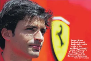  ?? PHOTO: GETTY IMAGES ?? Ferrari driver Carlos Sainz, of Spain, talks to the media in the paddock yesterday ahead of Monday’s F1 Grand Prix of Spain at Circuit de BarcelonaC­atalunya.