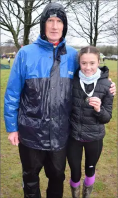  ??  ?? Claragh Keane (DMP) with coach John Joe Doyle. Claragh placed fifth in the All-Ireland Girls U-15 3,500m as well as winning team gold with Leinster.
