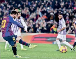  ?? —AP ?? FC Barcelona’s Lionel Messi scores against Reak Valladolid in their La Liga match at Camp Nou in Barcelona on Saturday.