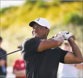  ?? Dante Carrer / Associated Press ?? Tiger Woods tees off from the 16th hole during the Hero World Challenge tournament at Albany Golf Club in Nassau, Bahamas on Thursday.