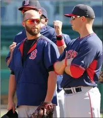  ?? File photo ?? Red Sox second baseman Dustin Pedroia (left) said Manny Machado didn’t try to hurt him Friday night at second base.