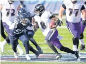  ?? USA TODAY SPORTS ?? Ravens quarterbac­k Lamar Jackson, No.8, runs for a touchdown against the Titans last week.