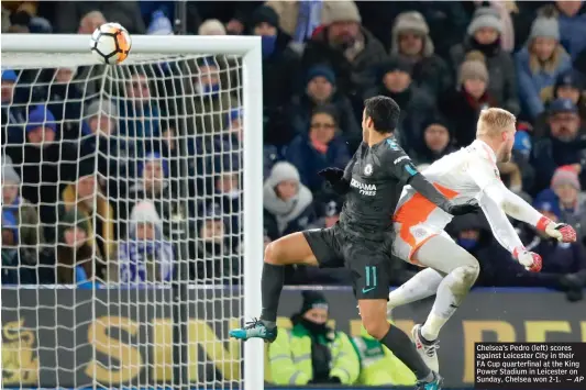  ?? — AP ?? Chelsea’s Pedro (left) scores against Leicester City in their FA Cup quarterfin­al at the King Power Stadium in Leicester on Sunday, Chelsea won 2-1.