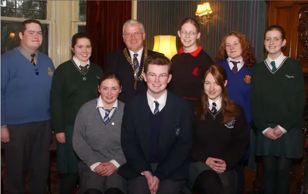  ??  ?? Stephen Gunne, Dundalk Rotary with nominees for the Rotary Youth Leadership Award in 2003. Included are (Front L-R) Aine McBride, Colaiste Ris, David Matthews, Dundalk Grammar School and Leoina Lennon, St. Mary’s College. (Back L-R) John Shevlin, De La Salle, Tara Erraught, Dun Lughbhaidh, overall winner, Lisa Dollard, O’Fiaich College, Katie Kerley, St. Vincent’s and Chandell Cooney, The House.