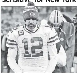  ?? USA TODAY Sports ?? THROUGH THICK AND THIN-SKINNED: A day after Aaron Rodgers ranted about what he said were erroneous reports, Tiki Barber (left) countered that Rodgers — who has been linked to the Jets — may not be cut out for New York.