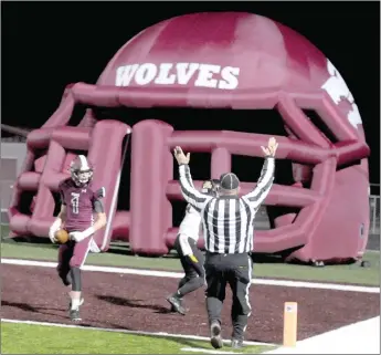  ?? MARK HUMPHREY ENTERPRISE-LEADER ?? Lincoln senior wide receiver Sterling Morphis fought off an attempted tackle by a Prairie Grove Tiger latching onto his hand as he crossed the goal line with a 27-yard touchdown reception in the second quarter Friday. Morphis caught 7 passes for 172 yards as the Wolves knocked off Prairie Grove, 59-48, to earn the third playoff seed from the 4A-1 Conference. Lincoln finished the regular season 8-2 overall and 5-2 in conference.