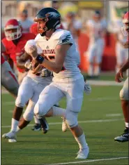  ?? NWA Democrat-Gazette/ANDY SHUPE ?? Rogers Heritage quarterbac­k Zach Brown carries the ball Friday as he is pursued by members of the Fort Smith Northside defense during the first half at Mayo-Thompson Stadium in Fort Smith. Visit nwadg.com/photos to see more photos from the game.