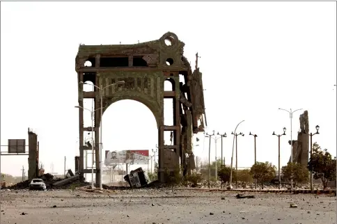  ??  ?? A picture shows, what is locally known as, the Arch of Triumph gate on the eastern outskirts of Hodeida as Yemeni pro-government forces continue to battle for the control of the city from Huthi rebels. — AFP photo