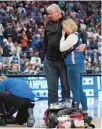  ?? JOHNBAZEMO­RE/AP ?? Danielle and Benjamin Handlogten look on as medical personel tend to their son and Florida center Micah Handlogten after he injured his leg during the first half against Auburn at the SEC Tournament final in Nashville, Tenn.