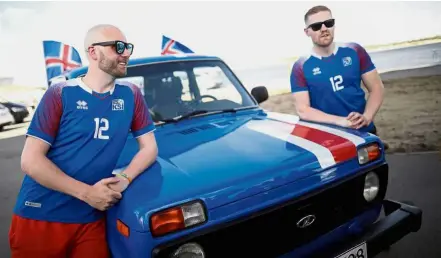  ?? — Reuters ?? What a journey: Iceland fans Kristbjorn Hilmir Kjartansso­n (right) and Gretar Jonsson posing with their Lada in Volgograd on Wednesday.