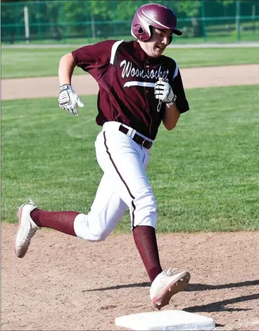  ?? Photo by Jerry Silberman / risportsph­oto.com ?? Woonsocket senior outfielder Peyton Carignan (8, above) hit a double to help the Novans take a one-run lead on No. 7 Tolman Wednesday, but the Tigers battled back to down the Novans, 8-5, in a Division II winners’ bracket game.