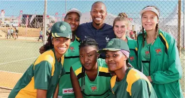  ?? SUPPLIED ?? SURPRISE VISITOR: Long jump world champion Luvo Manyonga took time to support the country’s top netball players at the national championsh­ips in Port Elizabeth. Manyonga is seen here with some players from Ehlanzeni Netball from Mpumalanga.