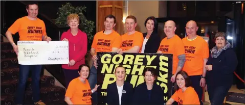  ??  ?? At a ceremony in The Amber Springs Hotel, Gorey, last week, Cllr John Hegarty presented €10,000, proceeds from the recent Gorey 5K Night Run to North Wexford Hospice Homecare chairperso­n Marian Deering, watched on by volunteers, runners and supporters.