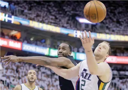  ?? —AP ?? SALT LAKE CITY: Los Angeles Clippers forward Luc Richard Mbah a Moute, rear, and Utah Jazz forward Joe Ingles (2) vie for a rebound during the first half in Game 6.