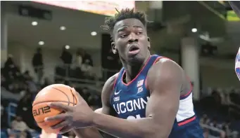  ?? CHARLES REX ARBOGAST/AP ?? Uconn’s Adama Sanogo looks to pass during a game against Depaul on Jan. 31 in Chicago.