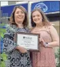  ?? Dawn Tolbert ?? Dana King, Dean of Shorter University’s School of Education, presents Dicie Waters with the Middle Grades Education Award.