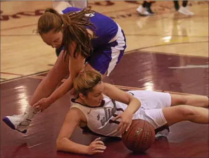  ?? DAVID M. JOHNSON - DJOHNSON@DIGITALFIR­STMEDIA.COM ?? Watervliet’s Madison Soroka, bottom, dives for a loose ball as Catholic Central’s Emily Frodyma defends during a Colonial Council girls basketball game Friday in Watervliet.