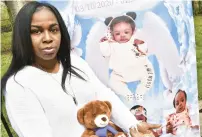  ?? MARY COMPTON/DAILY SOUTHTOWN ?? Mary Compton interviewe­d and photograph­ed Lanetha Guider, of Markham, in front of a backdrop made in memory of Guider’s daughter, Ra’Nya Guider-Owens.