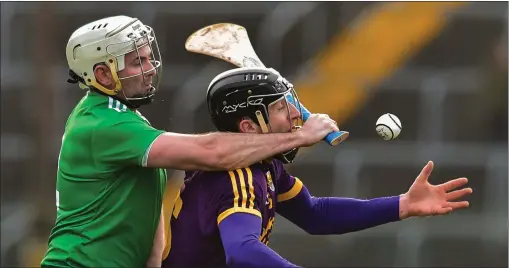  ??  ?? Liam Og McGovern tries to retain possession as Limerick defender Tom Condon challenges him from behind.