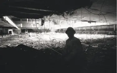  ?? Tom Levy / The Chronicle 1985 ?? A worker in the shadows looks at the interior of the Winterland Ballroom during its demolition in 1985.