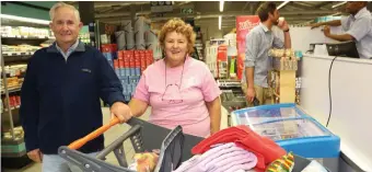  ??  ?? Norman Kroon and his wife, Jenny, won the 2-minute dash and decided to donate the contents of their trolley to Vuyani Safe Haven.