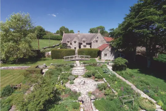  ??  ?? Above: Chicksgrov­e Manor in Wiltshire sits on the River Nadder. £4.5 million. Below: Coldpiece Farm, Hampshire, has links to the Duke of Wellington. £9 million