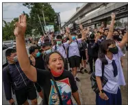  ?? (AP/Sakchai Lalit) ?? Pro-democracy demonstrat­ors salute Monday during a protest in a Bangkok suburb.