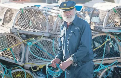  ?? BRIAN MCINNIS/THE GUARDIAN ?? Seventy-five-year-old Norman Peters has been fishing lobster out of North Rustico for 55 years and for 50 of those years his brother, Keith, has been going out into the Gulf of St. Lawrence with him. Norman’s son, Corey, was also with him Saturday so...