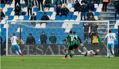  ?? AP ?? Lazio’s Ciro Immobile (left) scores from the penalty spot against Sassuolo at the Mapei Stadium in Reggio Emilia. —