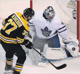  ?? BOSTON GLOBE ?? Toronto Maple Leafs goalie Frederik Andersen was “unvbelieve­able” in Saturday night’s 4-3 win in Boston, where he made 42 saves, including this one on the Bruins’ Patrice Bergeron.