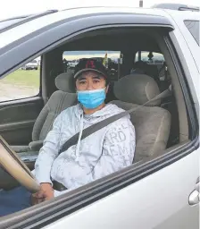  ?? LICIA CORBELLA ?? Nathaniel Pascua arrives for work at the Cargill plant outside High River on its first day open since the plant was shuttered for two weeks. His test for COVID-19 came back negative, but he showed up for work feeling sick. He had a fever and had lost his sense of taste and smell.