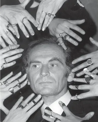  ?? AP ?? Pierre Cardin in 1969, at the launch of one of his jewellery collection­s. By 2000 his empire spanned nearly 100 countries, employing more than 200,000 people.