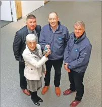  ??  ?? Back left to right: Councillor Roddy McCuish, John Forbes, TSL Contractor­s general manager, and Robert Forbes, TSL operations manager hand the keys to the new maritime centre to Councillor Elaine Robertson, chairwoman of the Oban Lorn and the Isles Area Committee.