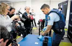  ?? Photo / Dean Purcell ?? Police launch a drug-screening device that will give instant results.