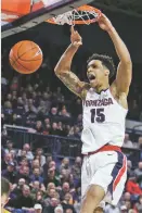  ?? YOUNG KWAK ASSOCIATED PRESS ?? Gonzaga forward Brandon Clarke dunks during Thursday’s game against San Francisco in Spokane, Wash. Gonzaga won 92-62. Clarke had 20 points and 16 rebounds.