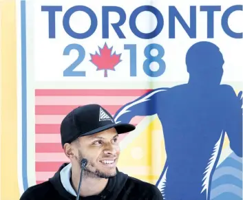  ?? NATHAN DENETTE/THE CANADIAN PRESS ?? Canadian track and field star Andre De Grasse speaks during a press conference after Athletics Canada announced the launch of the Toronto 2018 Track and Field in the 6ix in Toronto on Thursday.