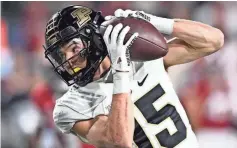  ?? MARC LEBRYK/ USA TODAY SPORTS ?? Purdue wide receiver Charlie Jones catches a long pass for a TD against Indiana.