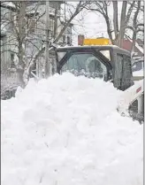  ?? CANADIAN PRESS FILE PHOTO ?? A plow clears snow from a Dartmouth street following one of the recent storms that walloped the Maritime.