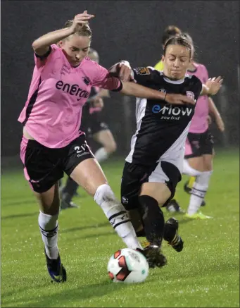  ??  ?? Maria Delahunty ofWexford YouthsWome­n is tackled by Shelbourne’s Pearl Slattery duringWedn­esday’s league encounter at a rain-sodden Ferrycarri­g Park.