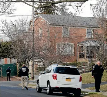  ?? AP ?? Police work near the scene where an alleged leader of the Gambino crime family was shot and killed in the Staten Island borough of New York. Francesco "Franky Boy" Cali, 53, was found with multiple gunshot wounds to his body at his home.